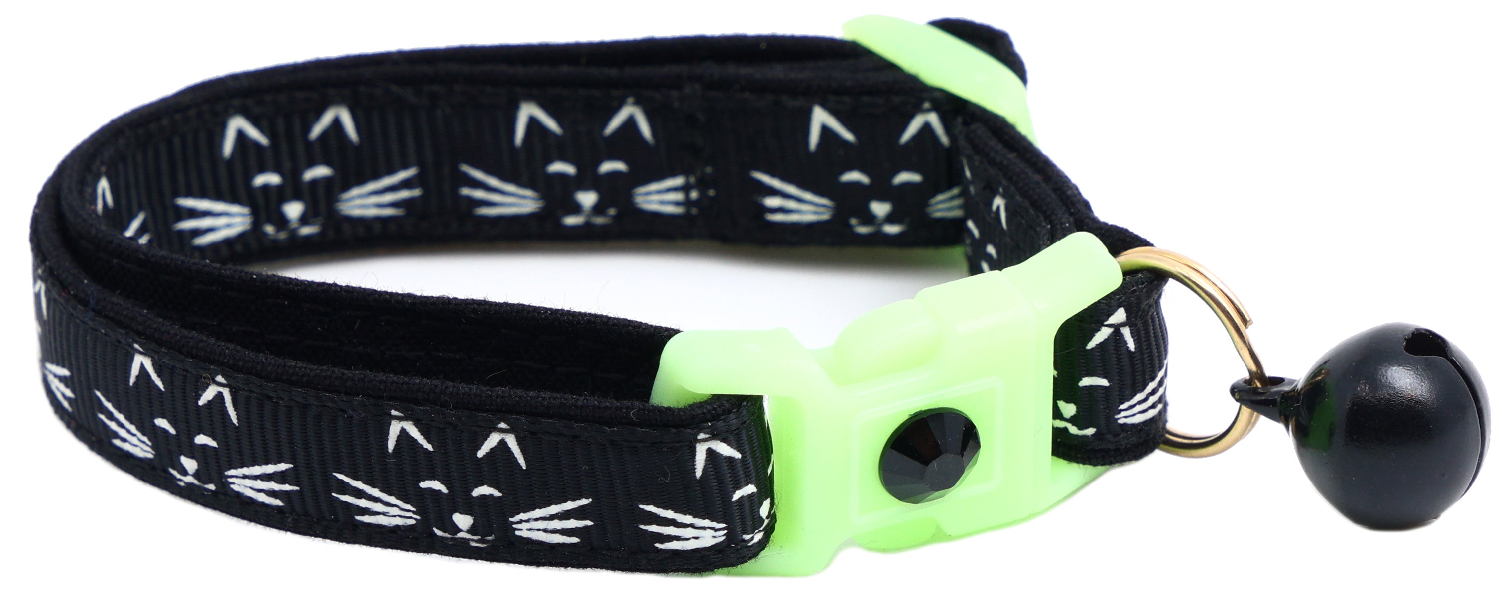 A glowing cat faces breakaway collar made of reinforced cotton, featuring a bell and charm, perfect for nighttime visibility.